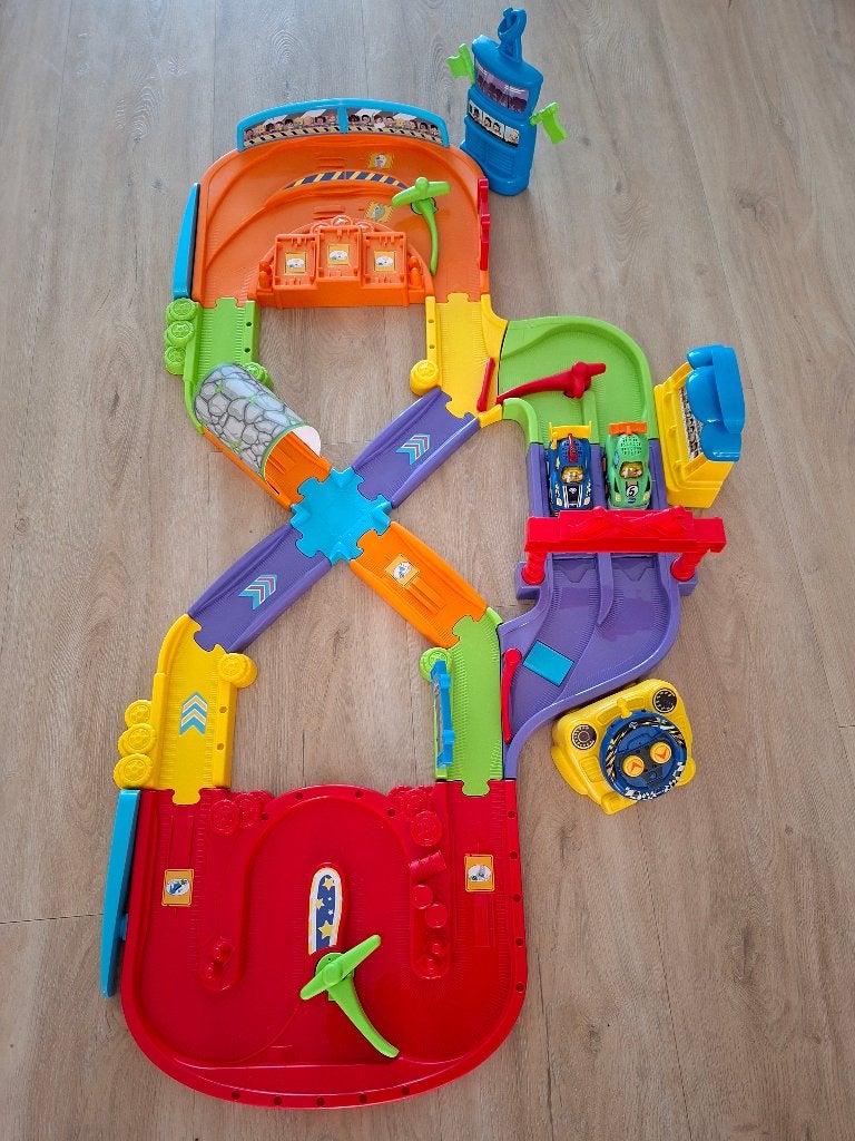 Vtech toet toet racebaan, Kinderen en Baby's, Racebaan, Zo goed als nieuw, Handmatig, Ophalen