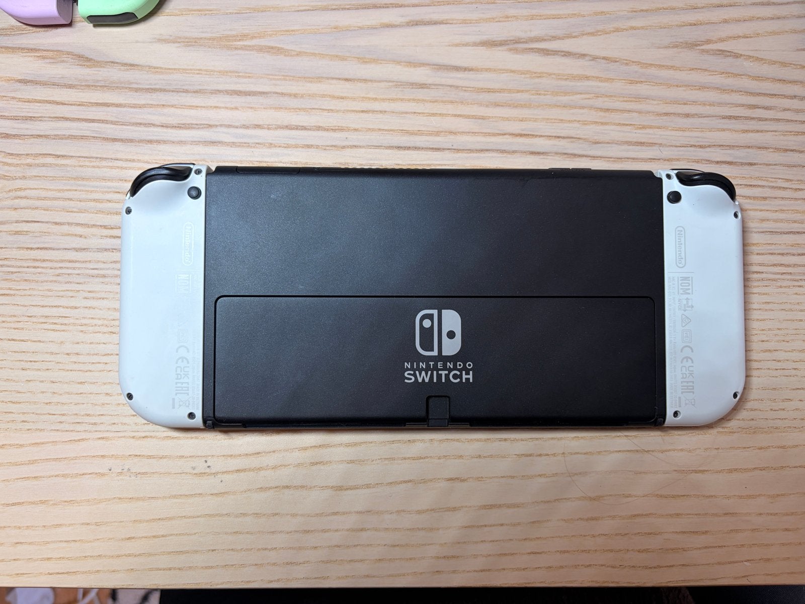 Foto 5 van Nintendo Switch OLED met extra controllers en games