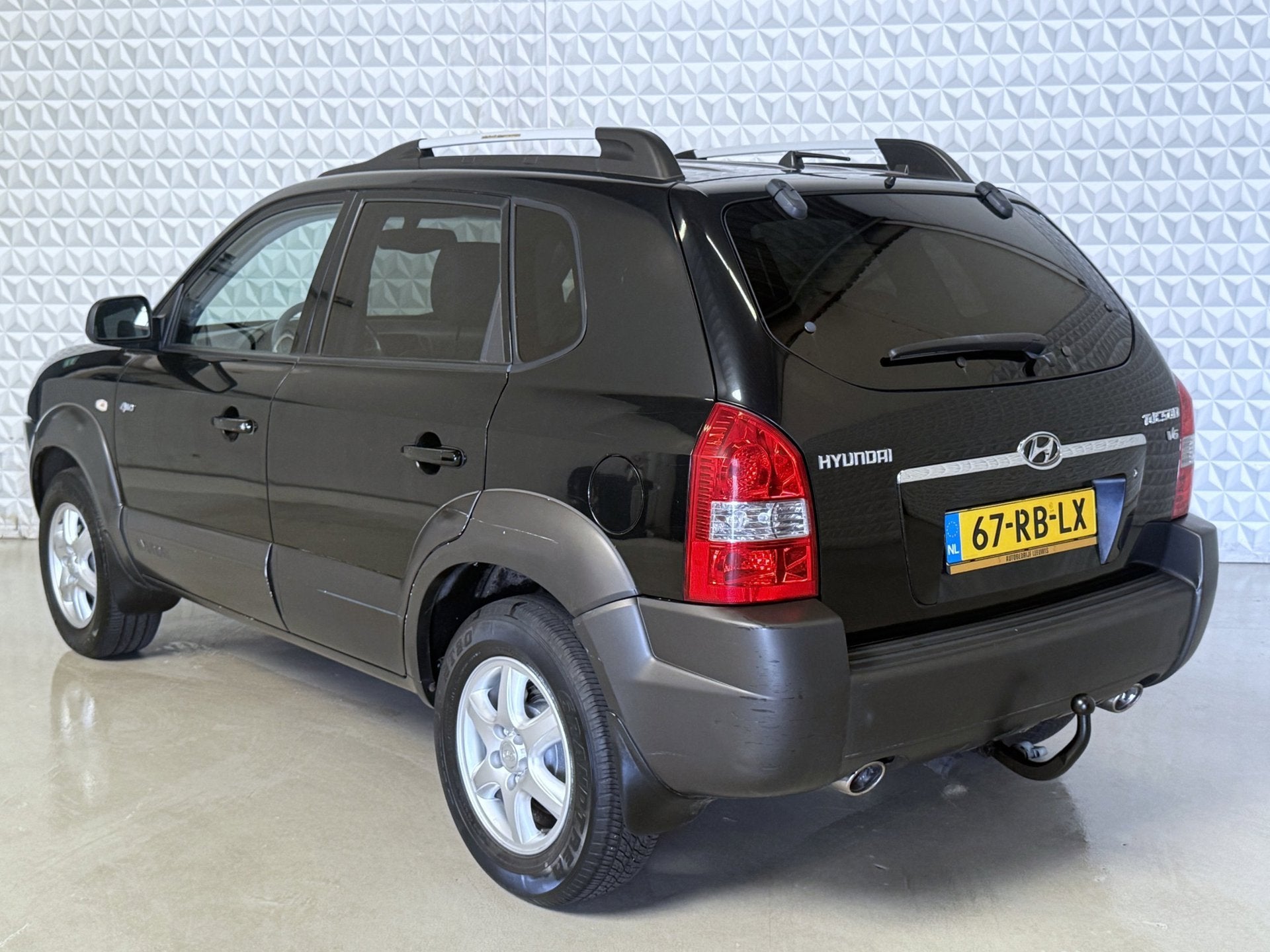 Hyundai Tucson 2.7i V6 4WD Style AUTOMAAT *UNIEK!* 97.000km, Auto's, Automaat, Gebruikt, 2656 cc, Zwart