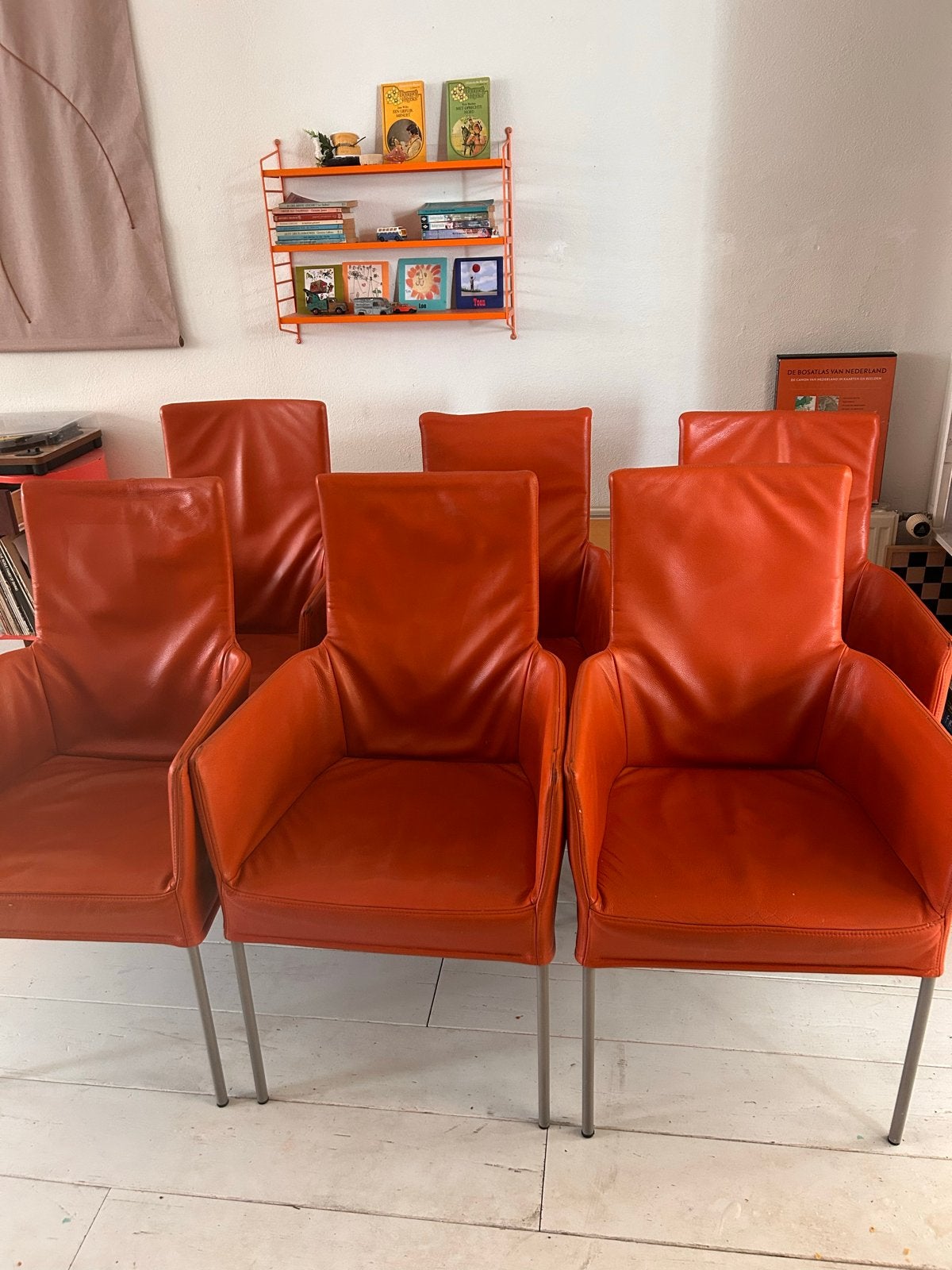 Montis Windy Oranje leren eetkamerstoelen met wieltjes, Gebruikt, Overige kleuren, Leer, Ophalen of Verzenden