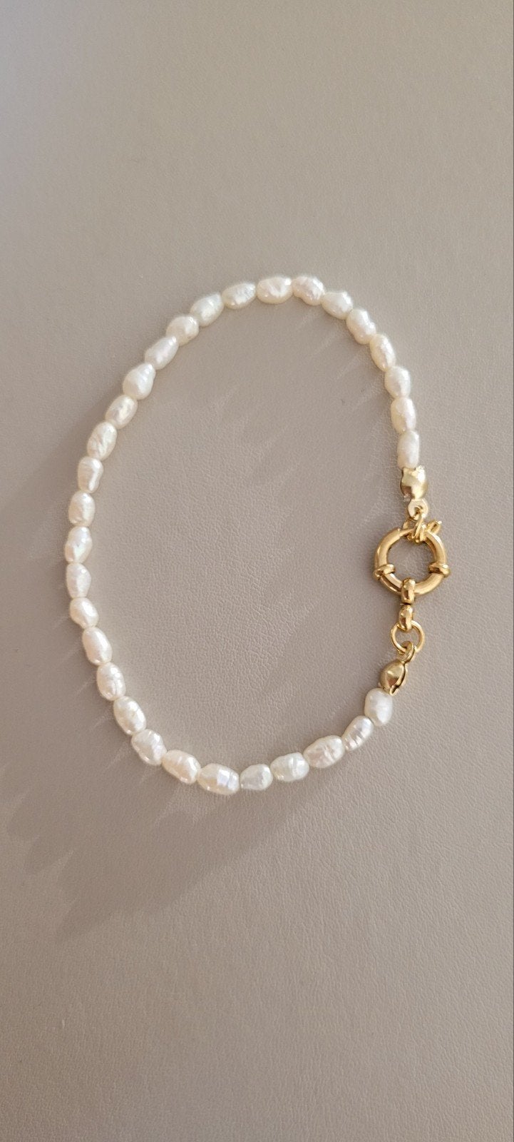 Parel armbandje, Ophalen of Verzenden, Zo goed als nieuw, Goud, Staal