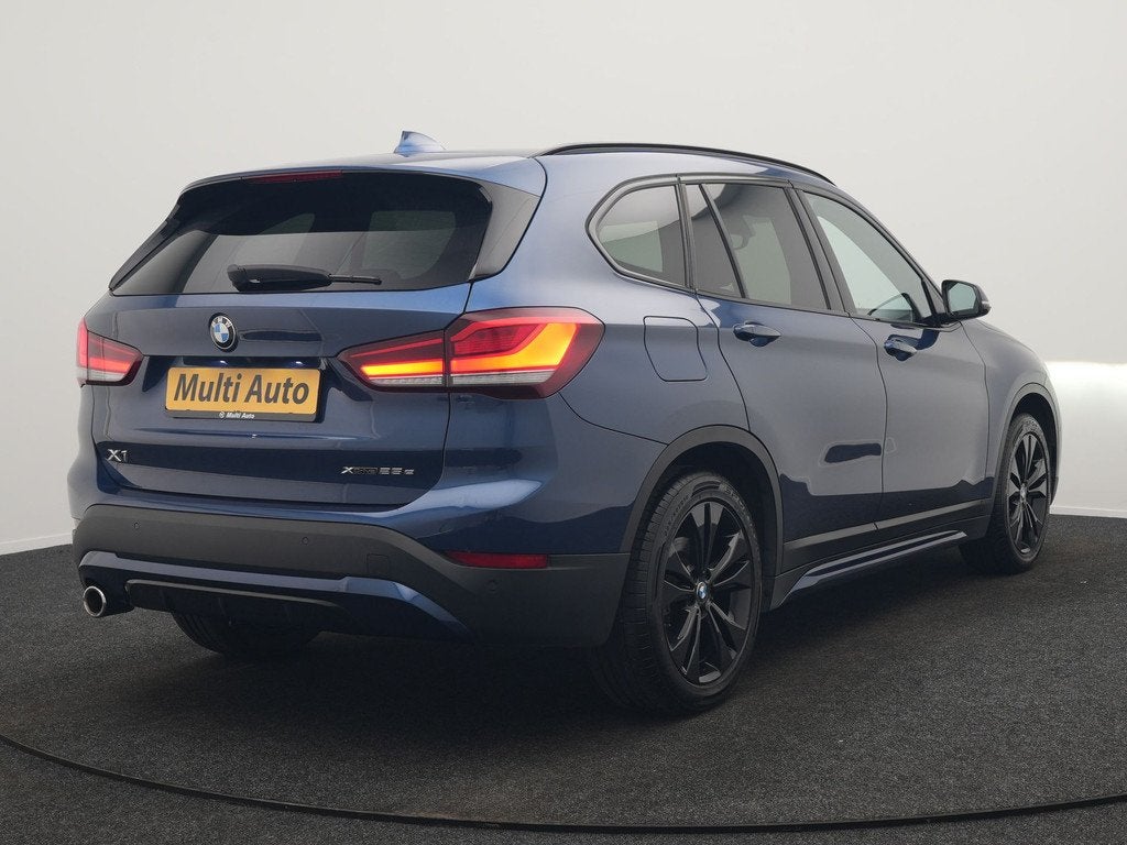 BMW X1 xDrive25e Sportline PHEV 221pk Dealer O.H. | Trekhaak, Gebruikt, Blauw, Leder en Stof, Bedrijf