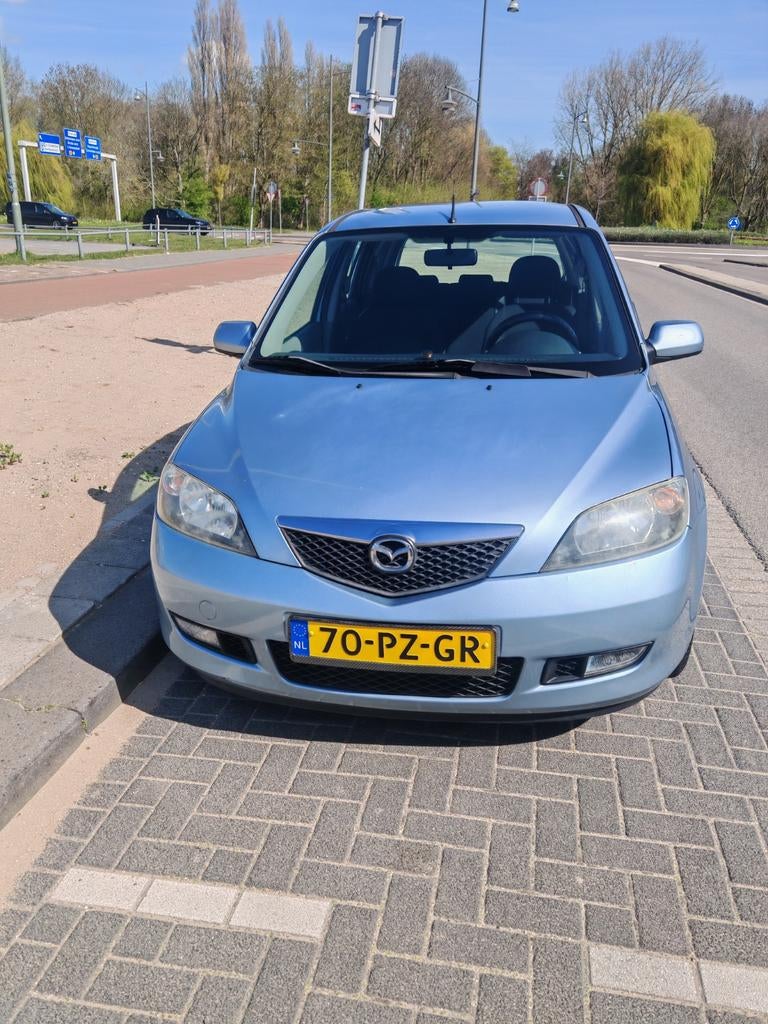 Mazda 2 1.4 16V 2005 Blauw, Auto's, Voorwielaandrijving, 1025 kg, 40 €/maand, Zwart