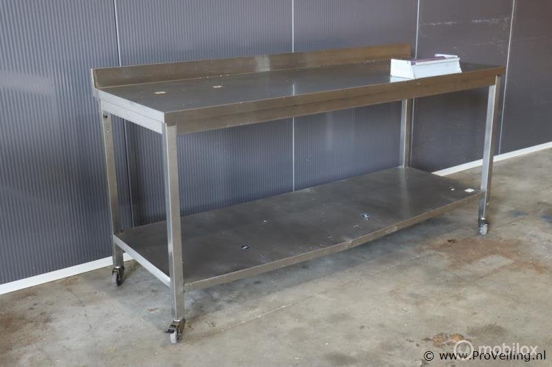 Online Veiling: Mobiele werktafel, RVS incl. rol folie in..., Gebruikt