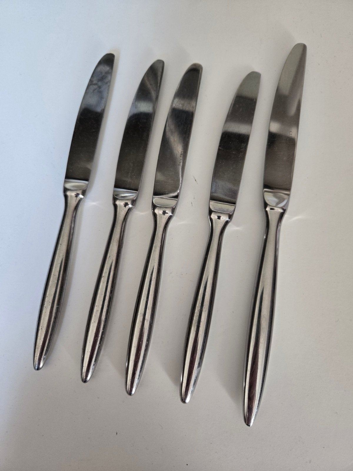 5 Guy Degrenne messen: 4 lunchmessen en 1 dinermes, Gebruikt, Los bestek, Ophalen of Verzenden, Rvs of Chroom