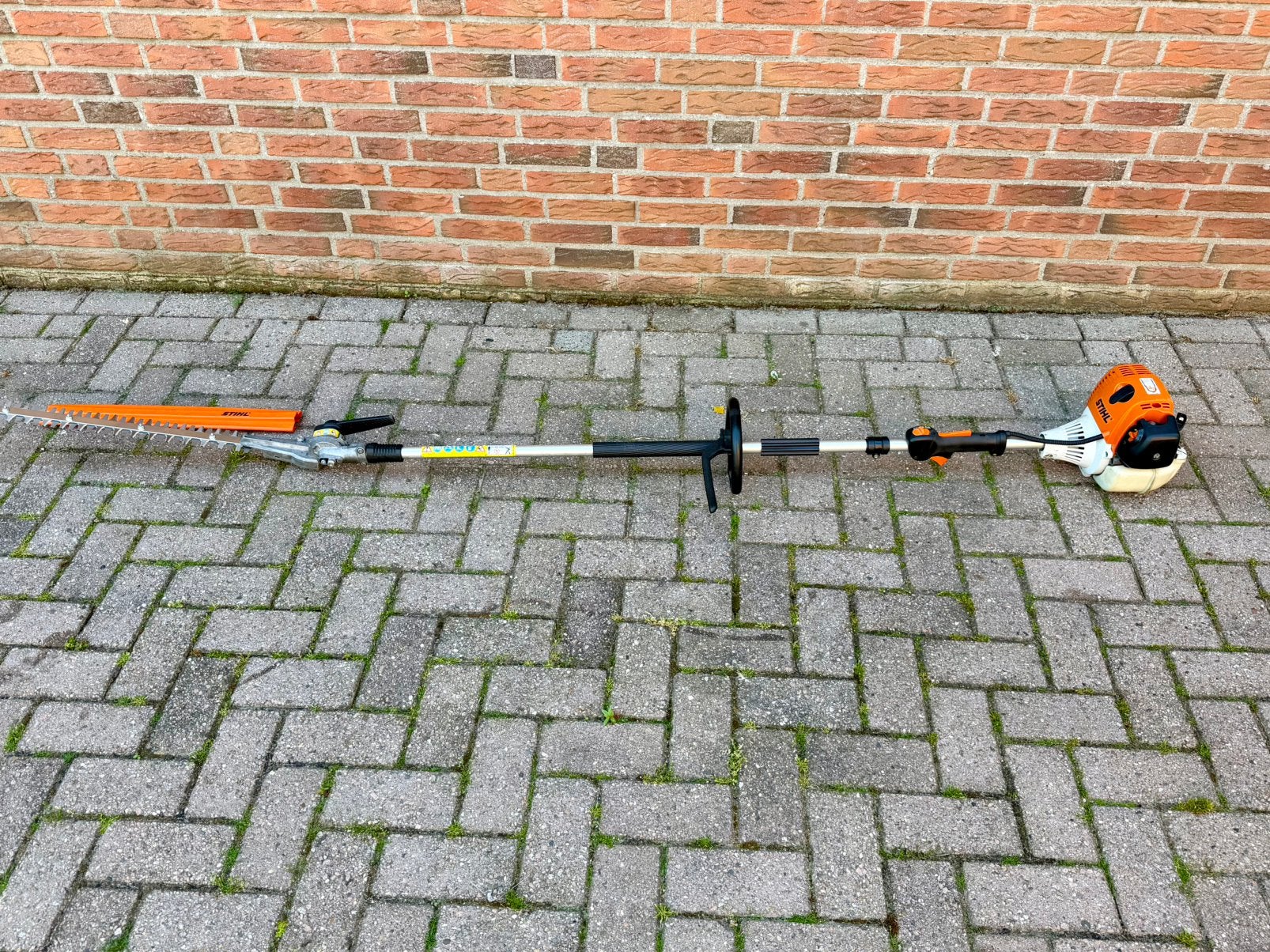 Stihl heggenschaar op steel, met benzine motor HL100, Ophalen, Gebruikt, Benzine