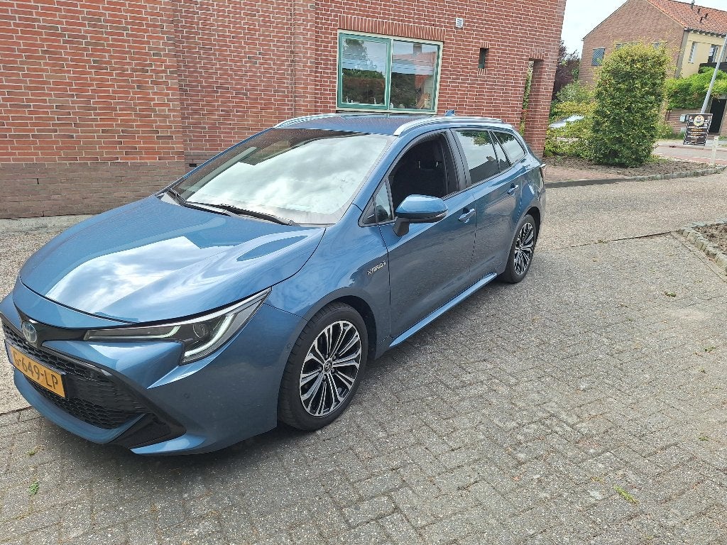 Toyota Corolla Touring Sports 1.8 Hybrid Business Plus., Auto's, 4 cilinders, Blauw, Corolla, Stationwagon