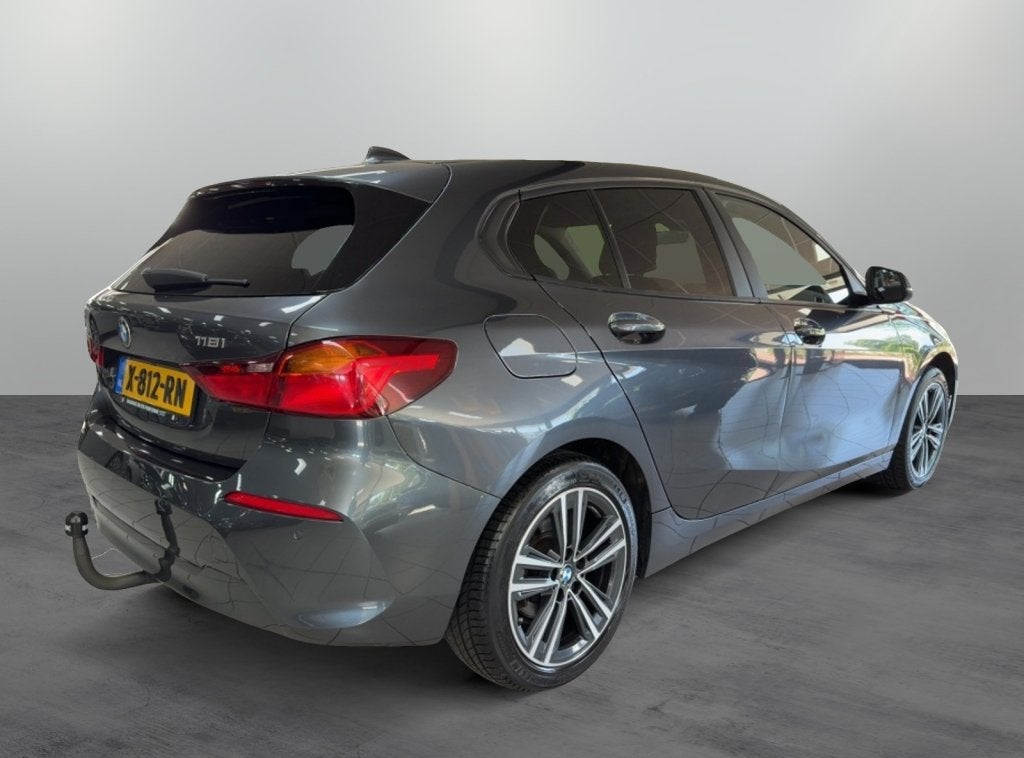 BMW 1-serie 118i High Executive Automaat Trekhaak (bj 2020), 12 maanden, Stof, Gebruikt, Origineel Nederlands