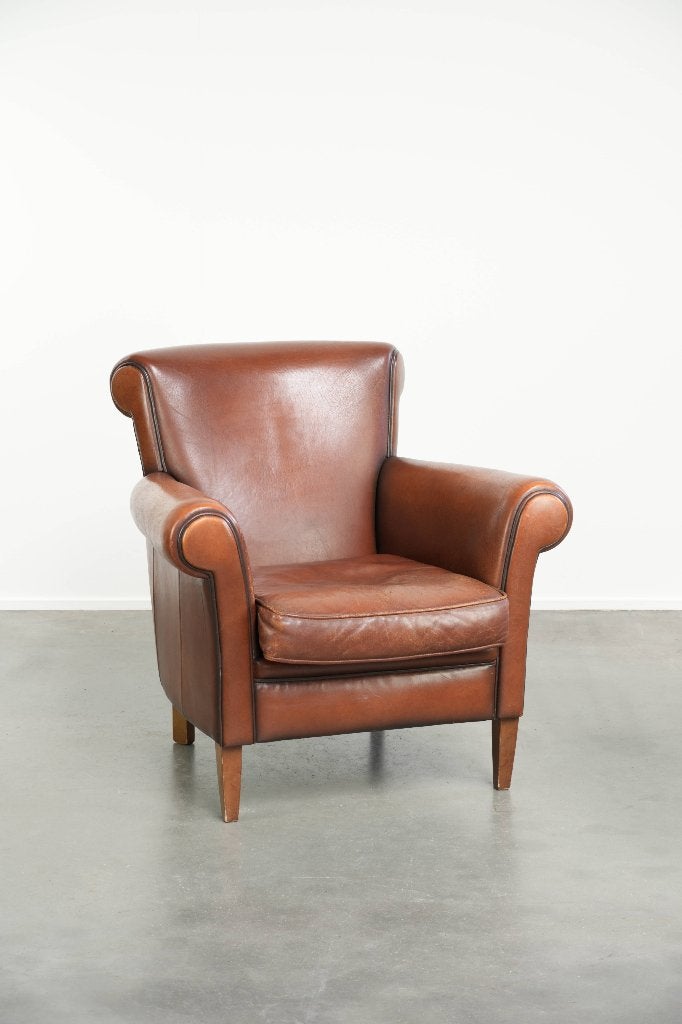 Tijdloze fauteuil/ armchair gemaakt van schapenleer, Huis en Inrichting, Fauteuils, Ophalen, Gebruikt, Klassiek, /