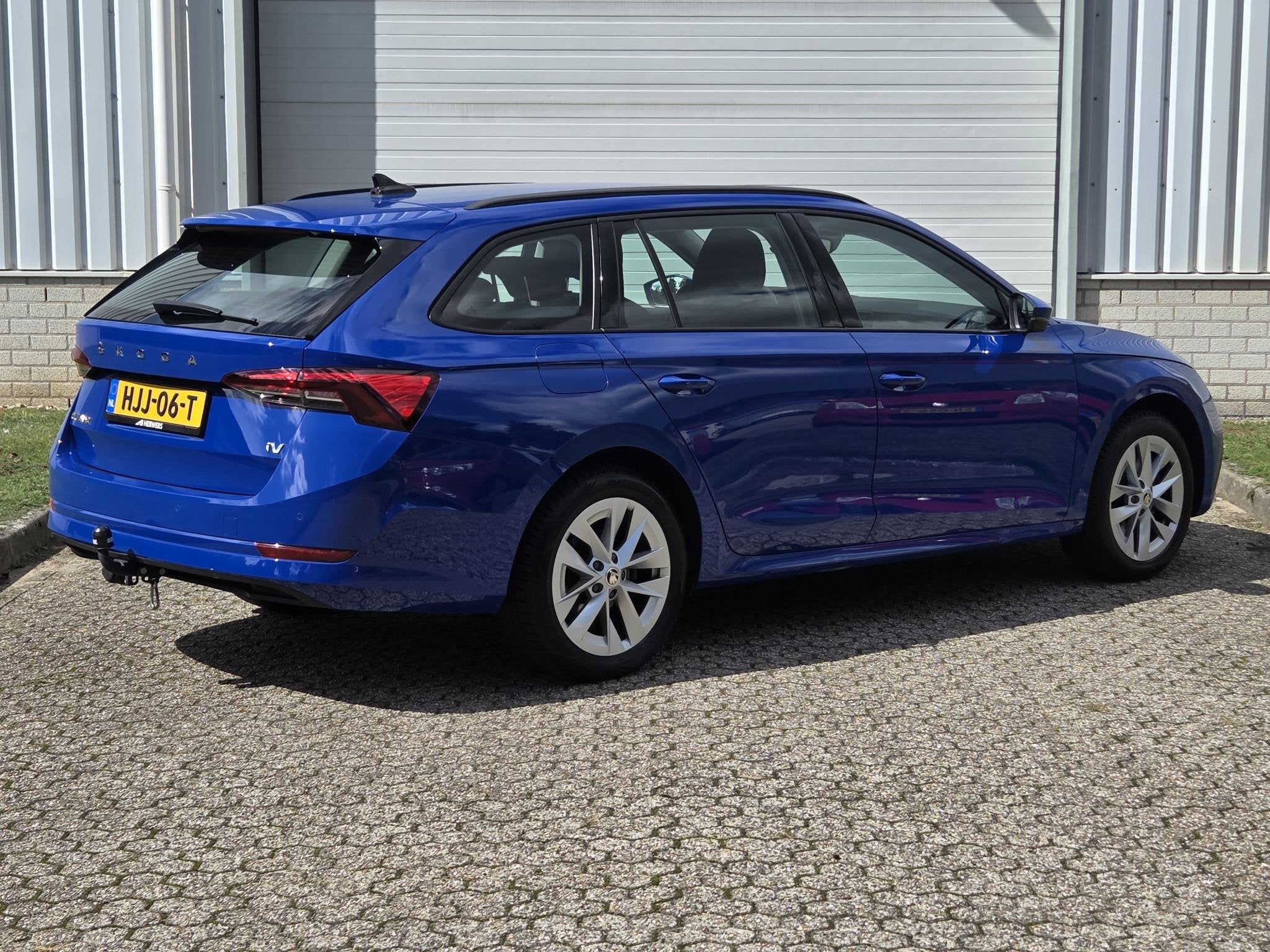 Skoda Octavia Combi 1.4 TSI iV PHEV Business Edition / Trekh, Auto's, Stof, Gebruikt, 4 cilinders, Blauw