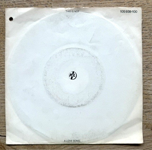 PIL - This is not a love son g, Cd's en Dvd's, Gebruikt, Fotohoes, 7 inch, Ophalen of Verzenden