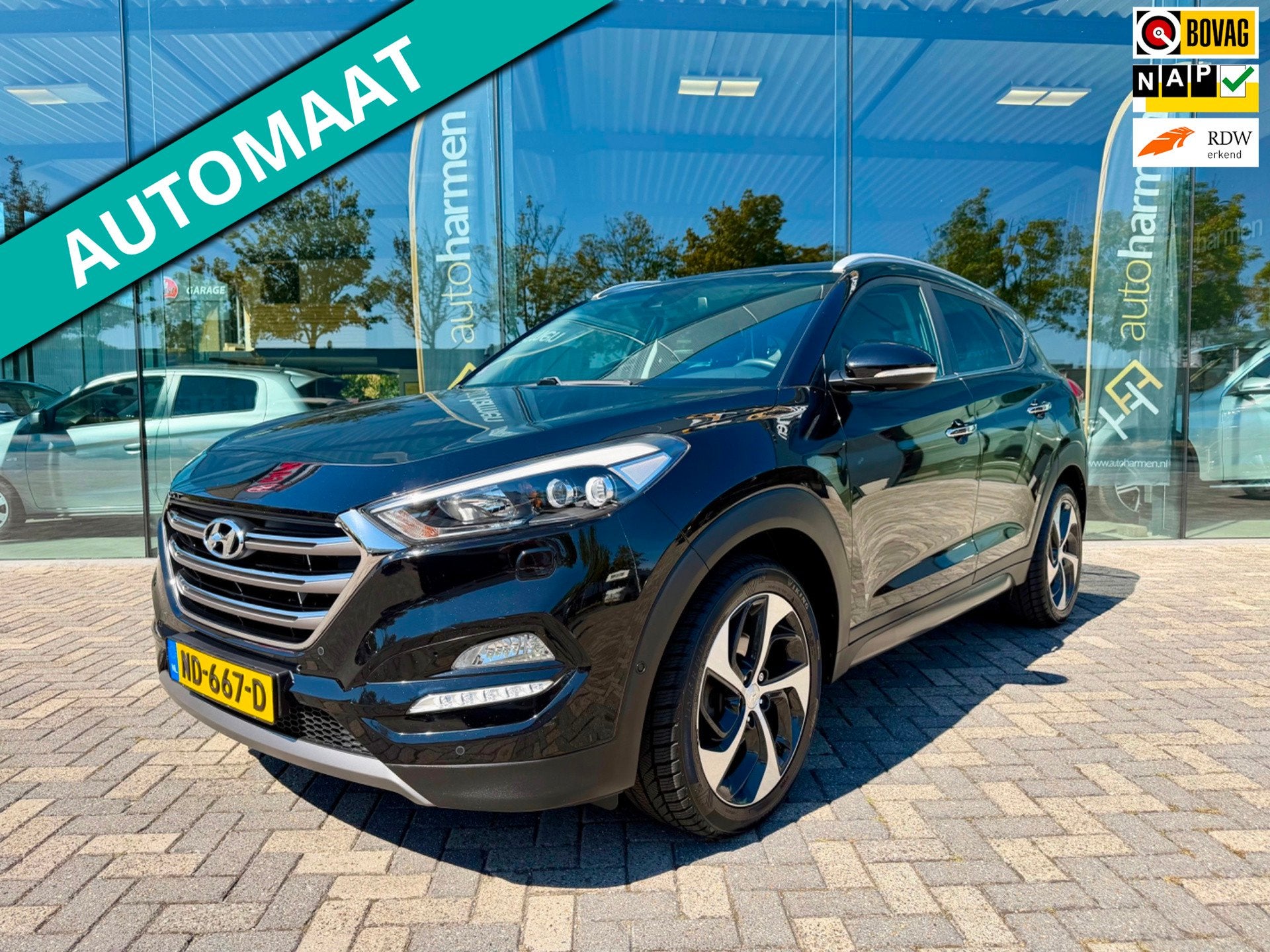 Hyundai Tucson 1.6 T-GDi automaat Premium 4WD, NAP, Trekhaak, Gebruikt, 4 cilinders, Zwart, Bedrijf