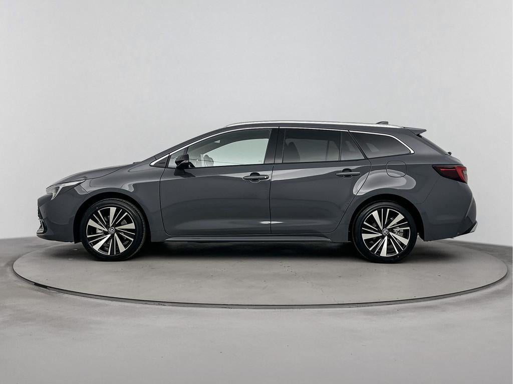 Toyota Corolla Touring Sports Hybrid 140 Dynamic | NIEUW & D, 12 maanden, Stof, Zwart, 4 cilinders