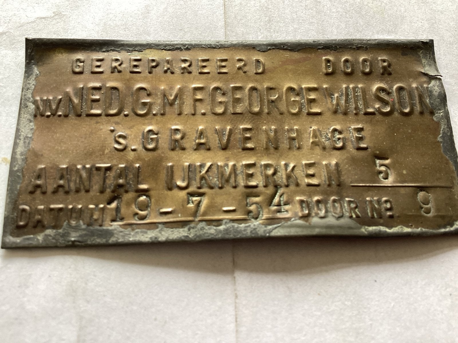 Koperen Plaat 'Gerepareerd door George Wilson' 7.5 x3.5 cm, Ophalen of Verzenden