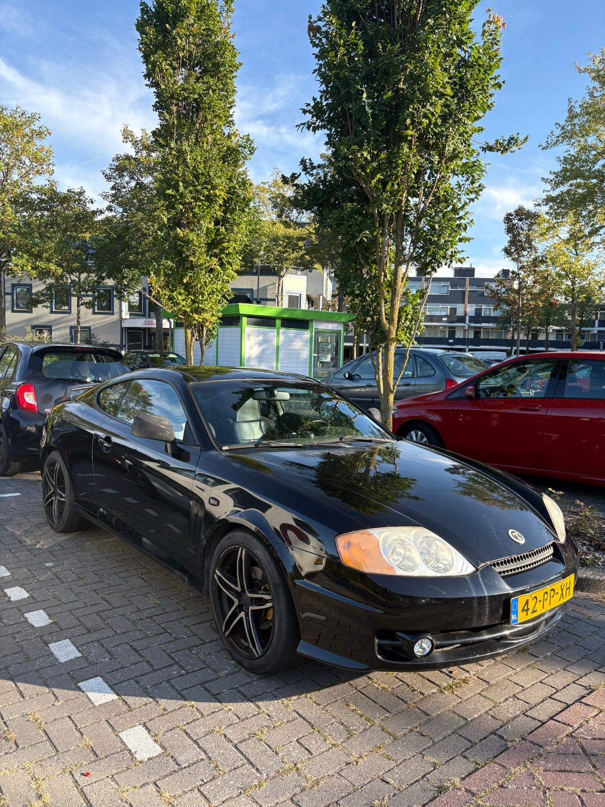 Hyundai Coupé 2.0 2004 Zwart, 4 stoelen, Zwart, Origineel Nederlands, Handgeschakeld