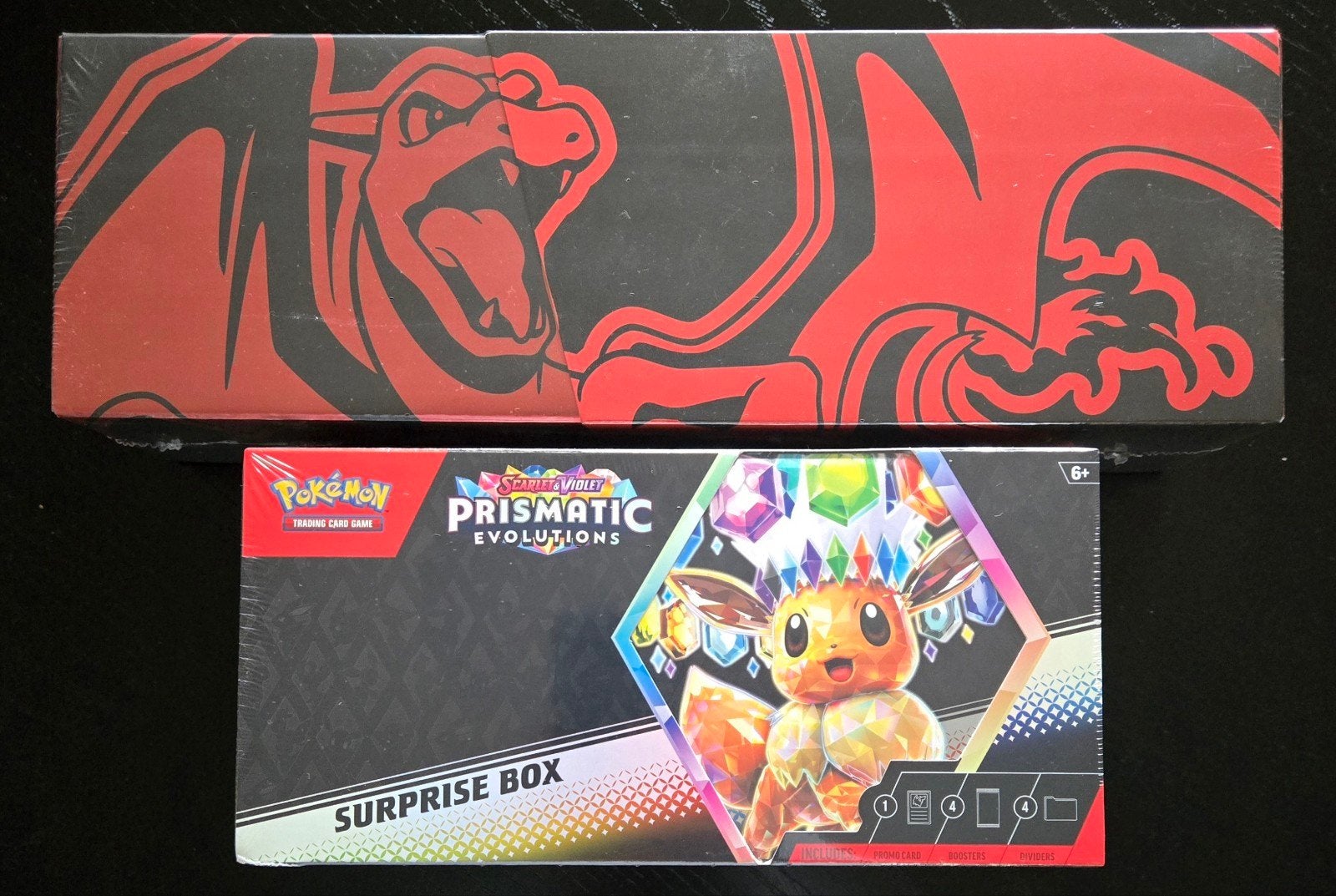 Prismatic Evolutions Surprise Box & 25th Anniv Charizard Box, Ophalen of Verzenden, Nieuw, Overige typen, Foil