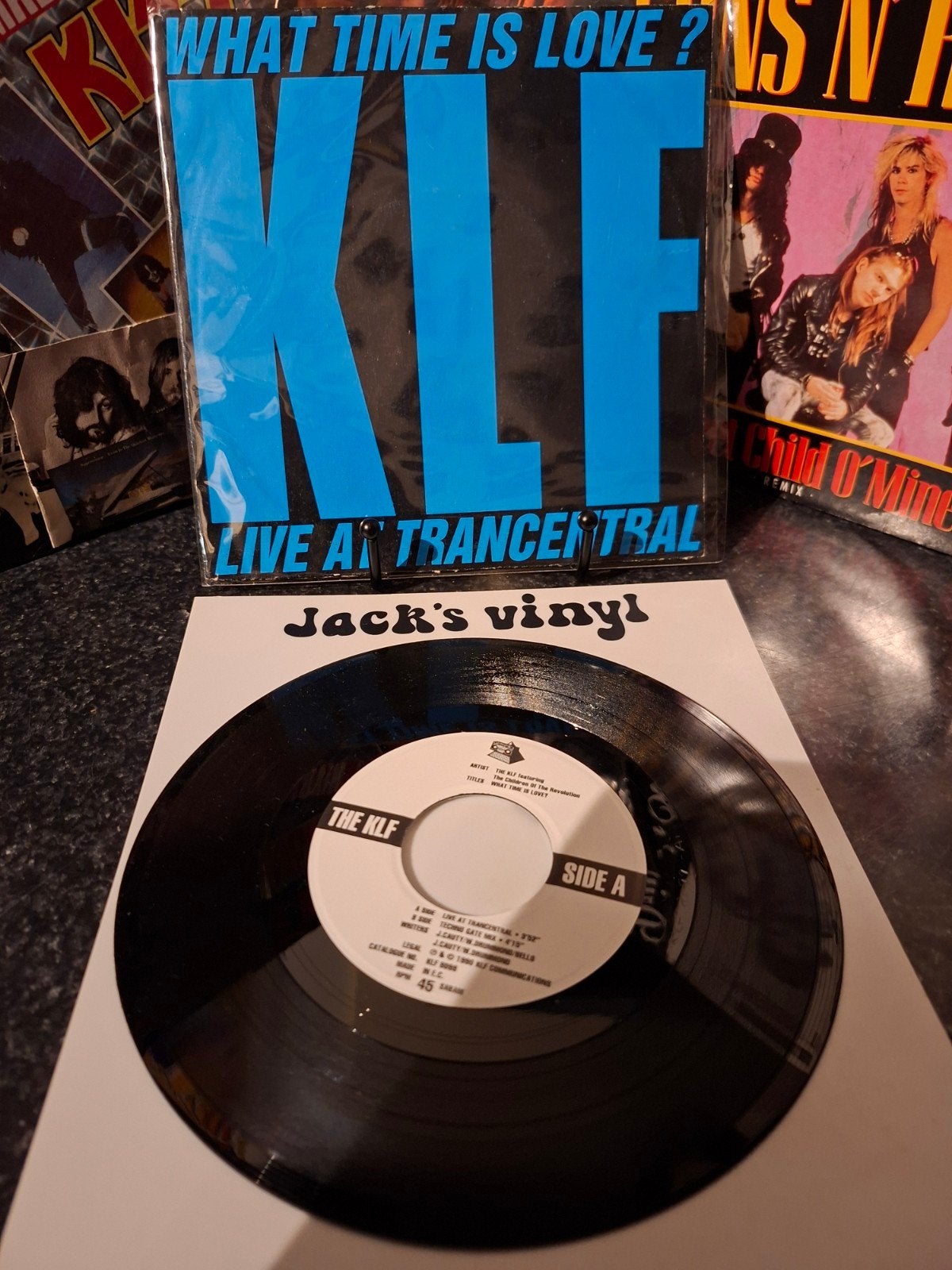 KLF - What Time Is Love? (Live At Trancentral) 1990, 7 inch, Ophalen of Verzenden, Zo goed als nieuw, Beschermende buitenhoes