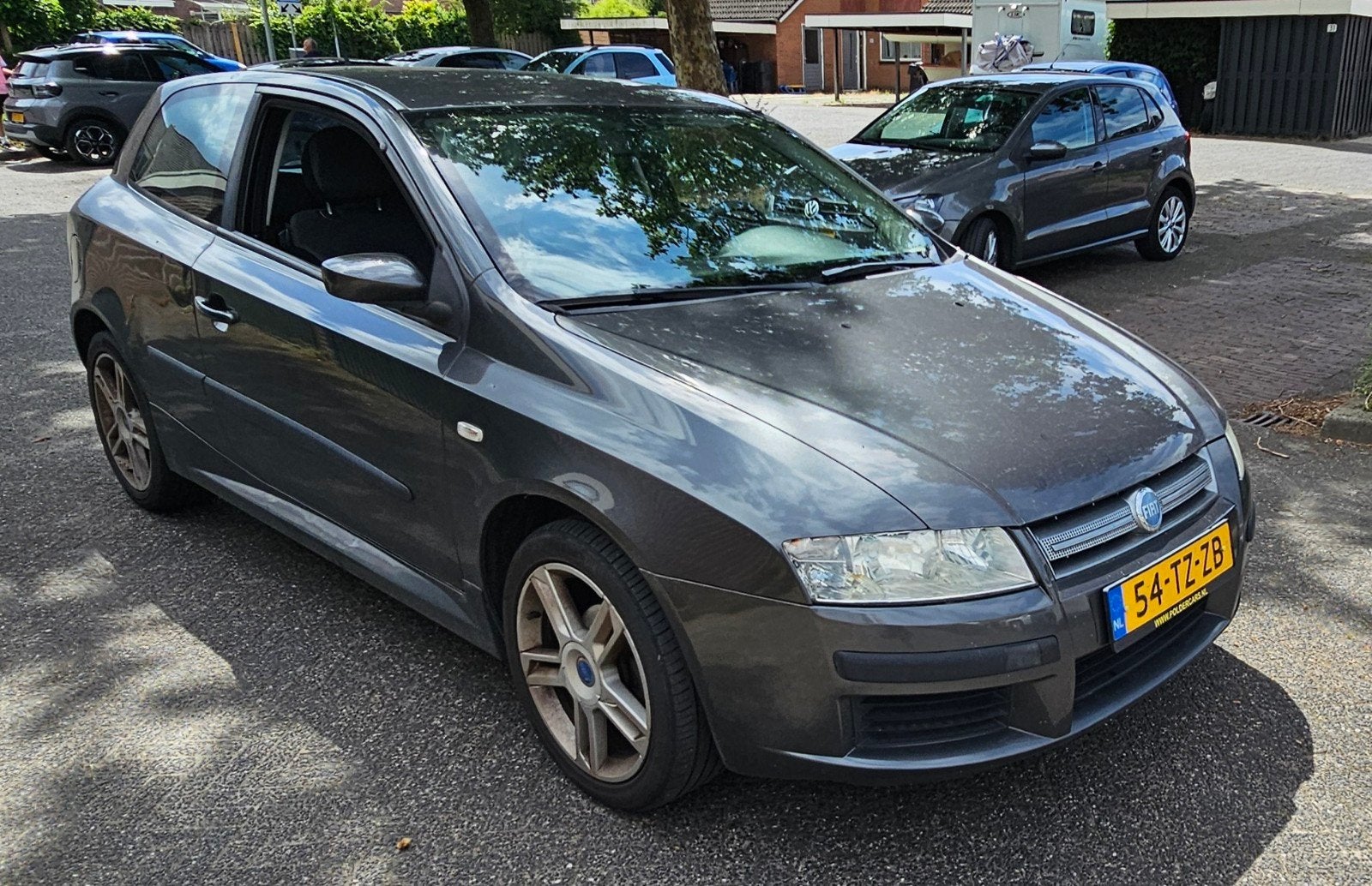 Fiat Stilo 1.6 16V 3DR 2007 Grijs, Auto's, Voorwielaandrijving, Zwart, Origineel Nederlands, Handgeschakeld