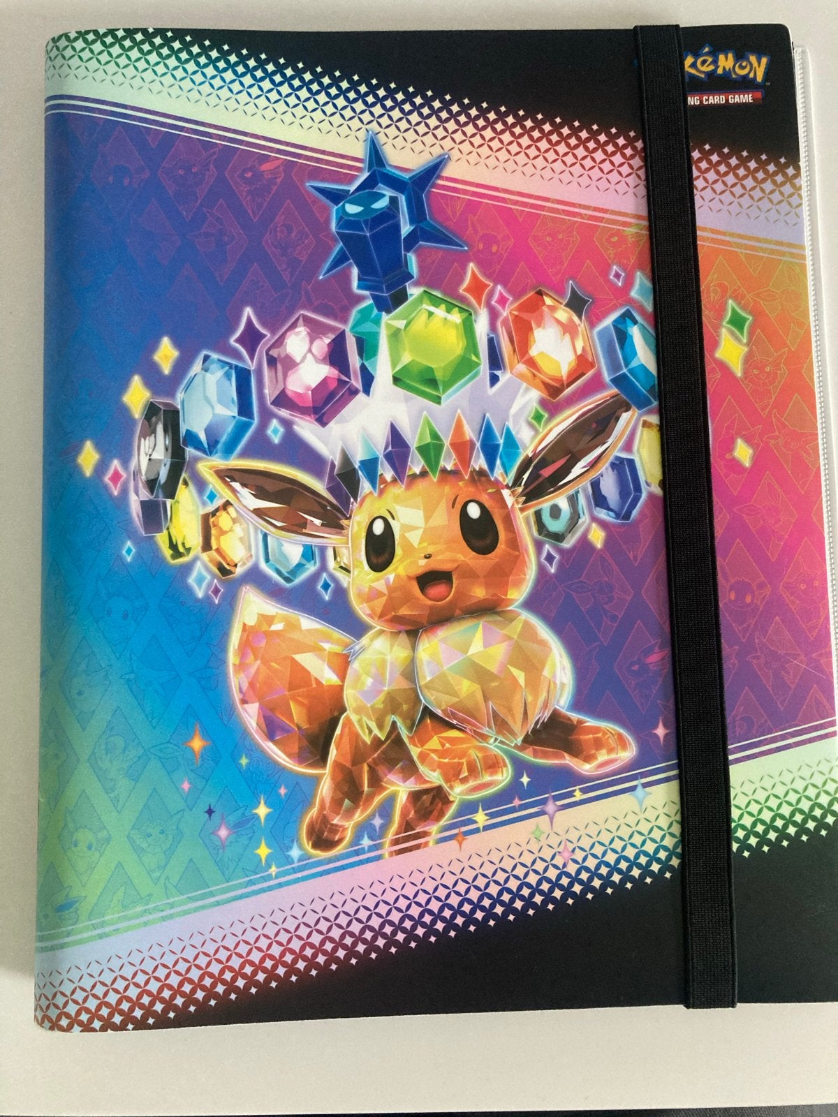 Prismatic Evolutions 9 pocket binder, Hobby en Vrije tijd, Verzamelkaartspellen | Pokémon, Ophalen of Verzenden, Gebruikt, Overige typen