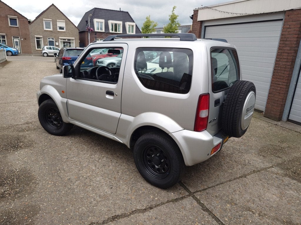 Suzuki Jimny 1.3 JLX Dealer onderhouden, Origineel NL met NA, Auto's, Keurmerk '100% Onderhouden', Euro 5, Zwart, 4 stoelen
