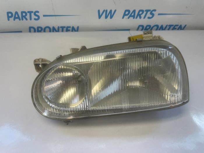 Koplamp links van een Volkswagen Golf, Gebruikt, -, Verzenden, -