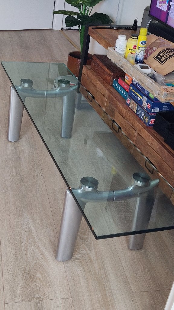 Glazen salontafel met aluminium leo-lux onderstel  €200, Ophalen, Gebruikt, Glas, 150 tot 200 cm