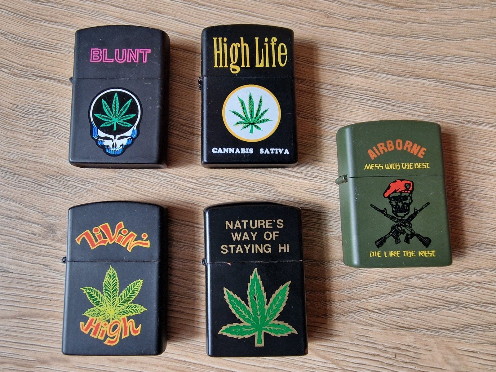 5 Zippo aanstekers met diverse opdrukken, Ophalen of Verzenden, Gebruikt, Aansteker