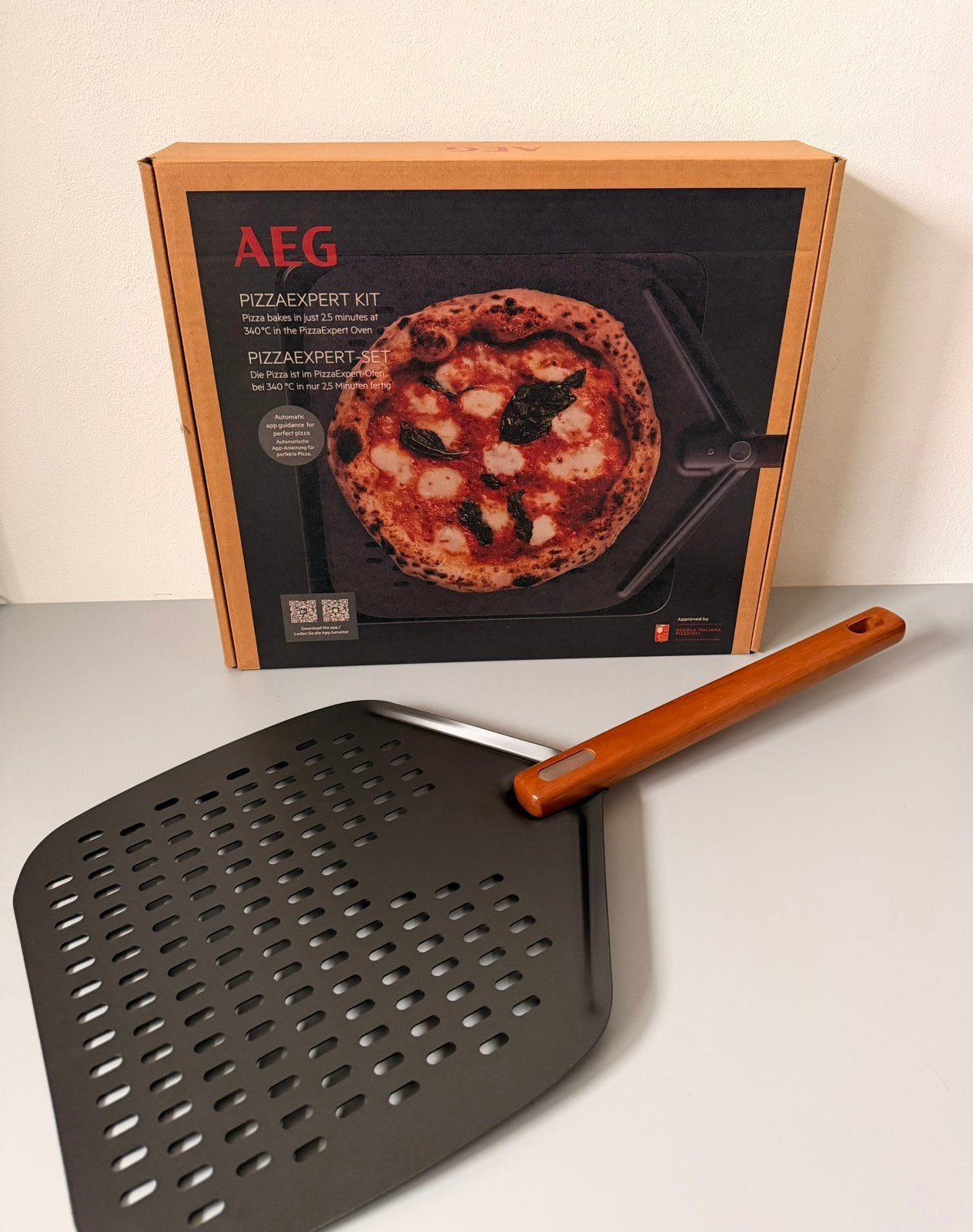 Nieuw | AEG pizzaplaat gietijzer & schep, Tuin en Terras, Barbecue-accessoires, Ophalen, Nieuw