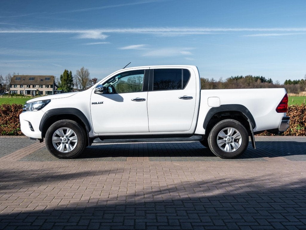 Toyota Hilux 2.4 D-4D-F Double Cab Professional Automaat DC, Auto's, Automaat, Stof, Gebruikt, 4 cilinders