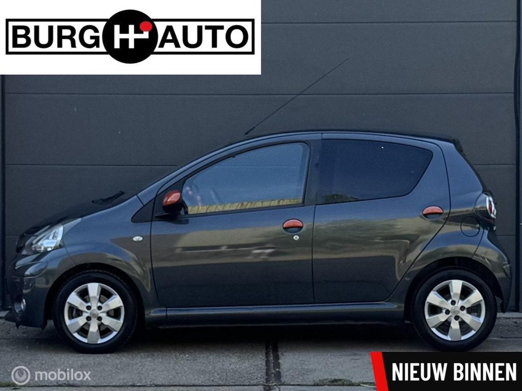 Toyota Aygo 1.0 VVT-i Dynamic Orange 5 deurs - AIRCO - LM VE, Auto's, Toyota, Bedrijf, Te koop, Aygo, ABS, Airbags, Airconditioning