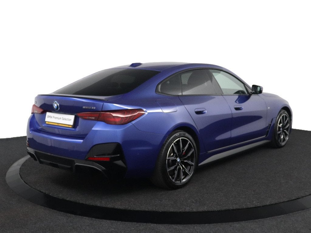 BMW i4 eDrive35 M Sport Edition 70 kWh | SOH 100% | M Sport, Auto's, BMW, Gebruikt, Zwart, Met garantie (alle), Blauw