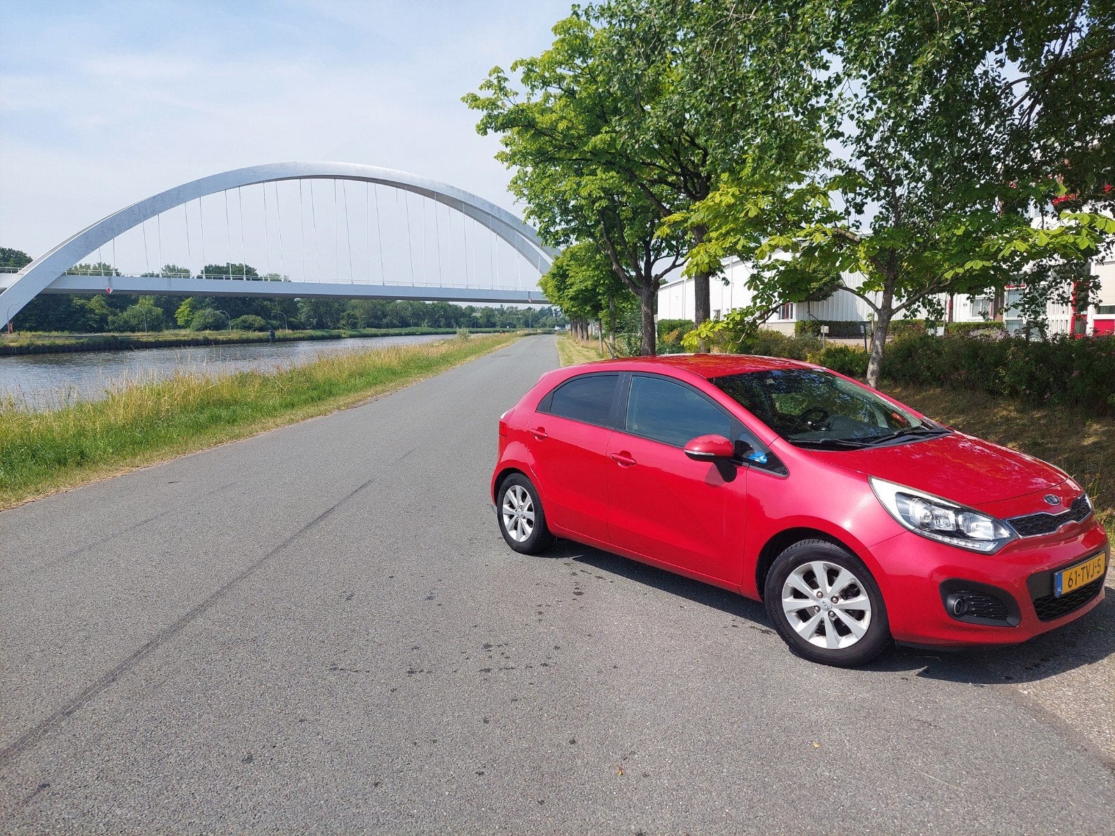 Kia Rio 1.2 I 5DRS 2012 Rood (63kw) met nieuwe APK, Auto's, 40 €/maand, Zwart, 4 cilinders, Origineel Nederlands