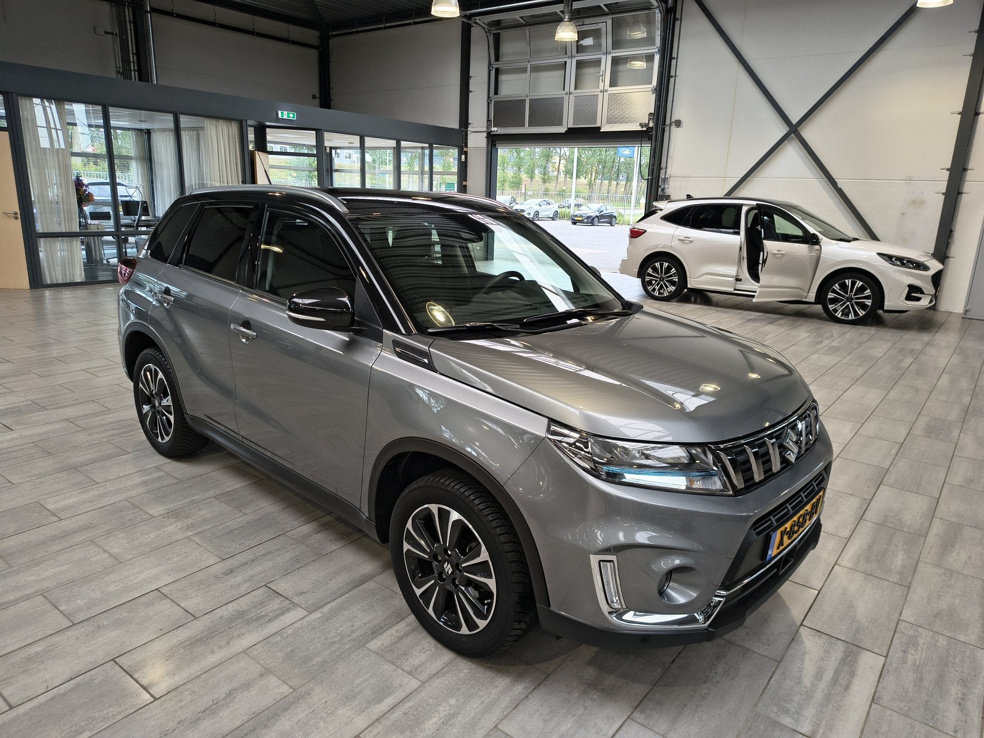 Suzuki Vitara 1.4 Boosterjet Style Smart Hybrid | Trekhaak |, 12 maanden, Gebruikt, 4 cilinders, 49 €/maand