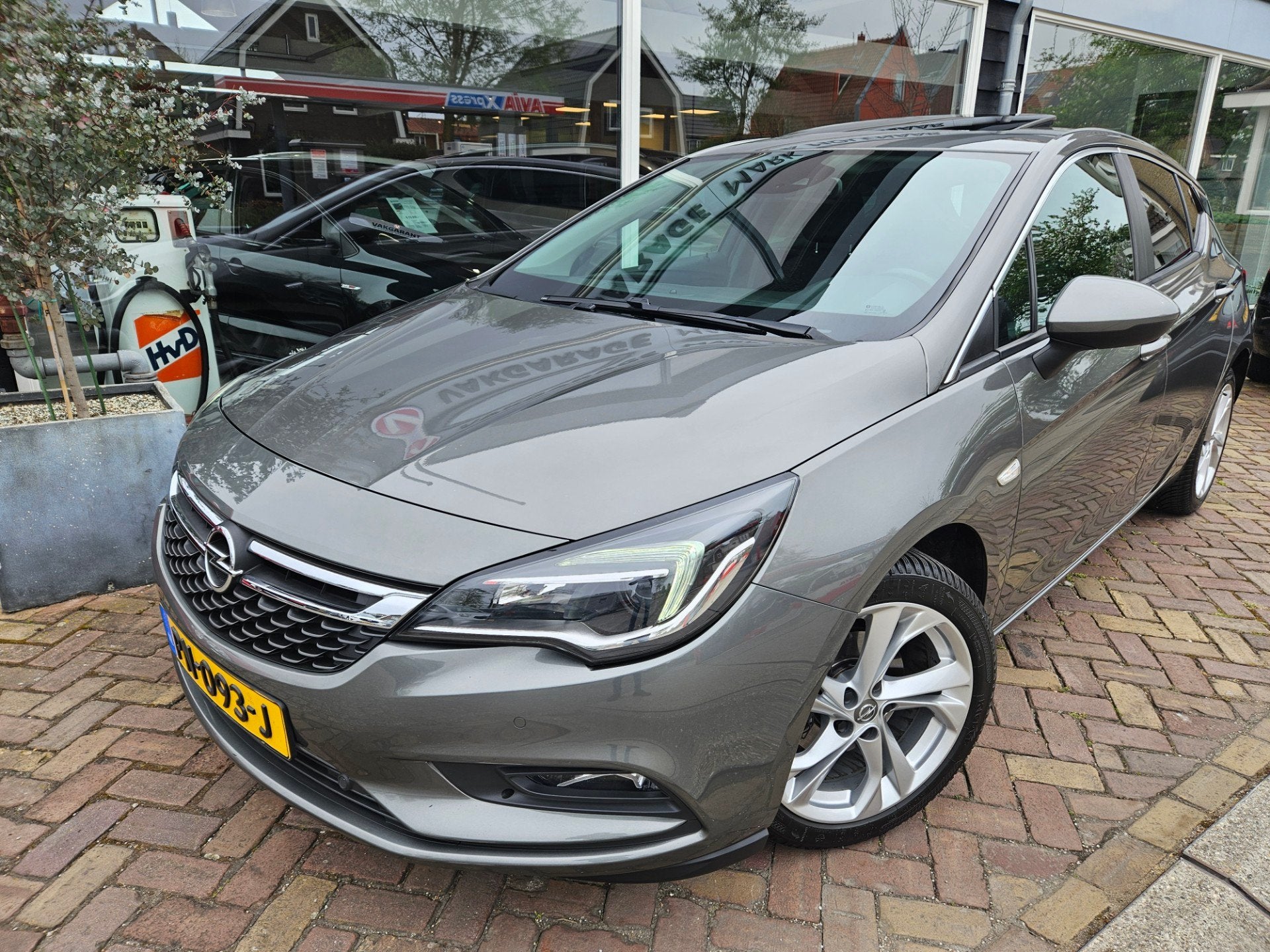 Opel Astra 1.0 Online Edition,opendak,carplay, Auto's, Gebruikt, Euro 6, 610 kg, 23 km/l