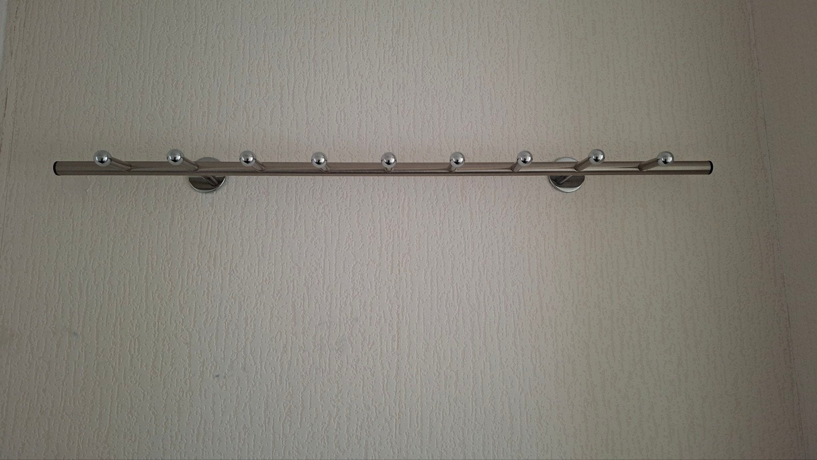 Metalen wandkapstok met 9 haken, Ophalen
