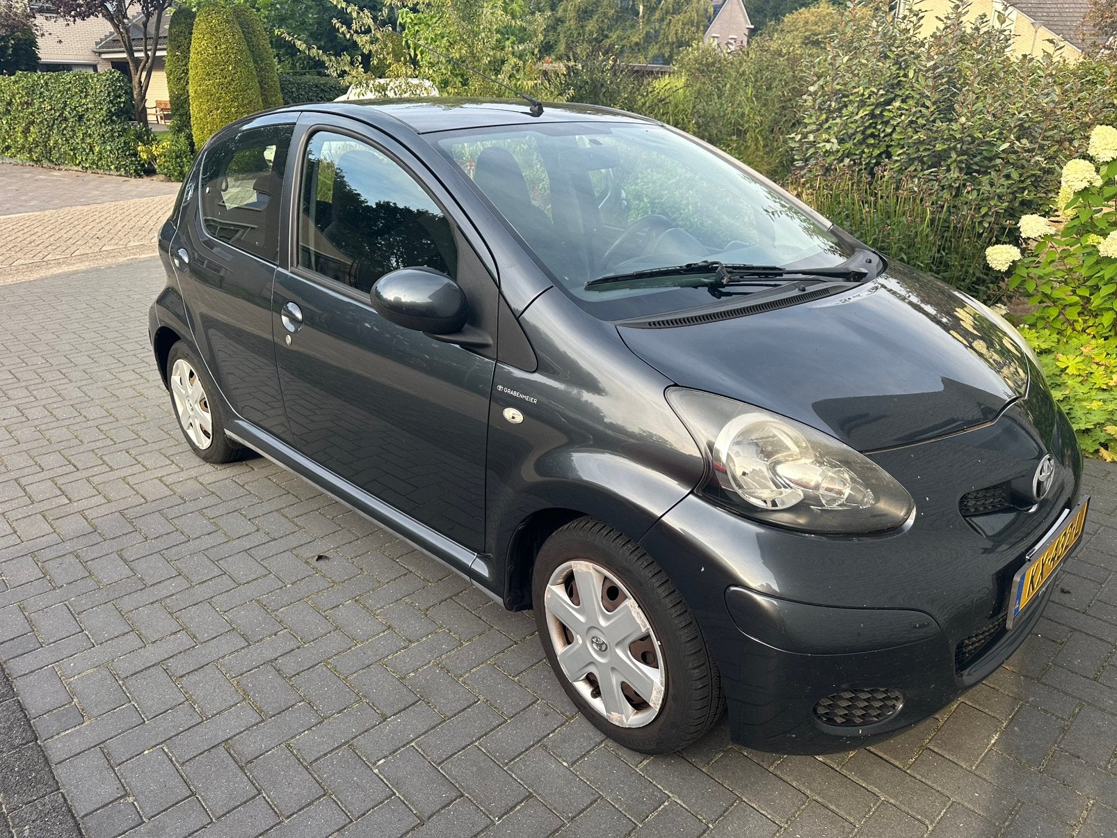 Toyota Aygo 1.0 12V Vvt-i 5DRS 2010 Grijs, Auto's, Toyota, Voorwielaandrijving, Stof, Zwart, 4 stoelen