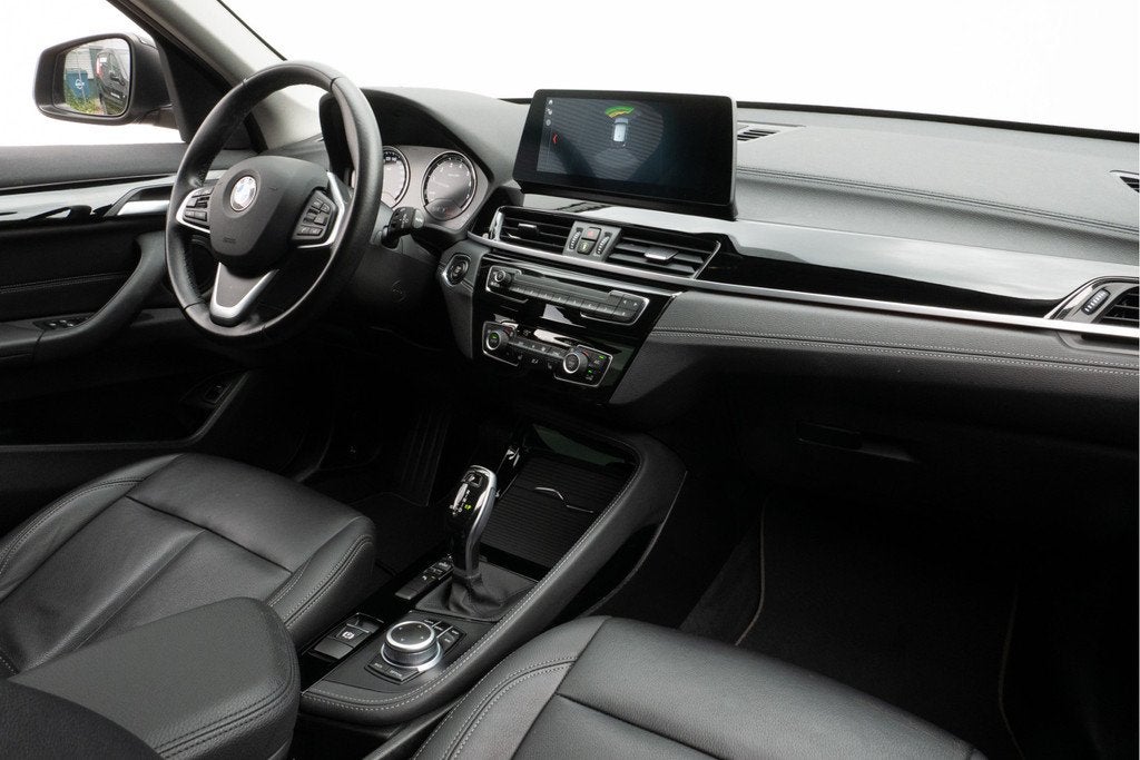 BMW X1 sDrive20i Business Edition Plus Leer/ Stoelverwarming, Auto's, 1998 cc, 4 cilinders, Met garantie (alle), 179 pk