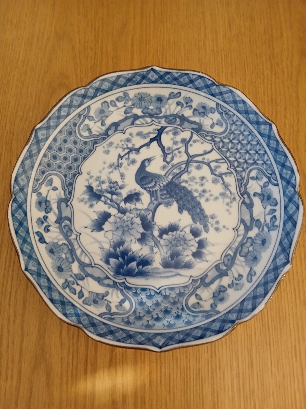 Decoratief bord met pauw en bloesemmotief, Ophalen of Verzenden