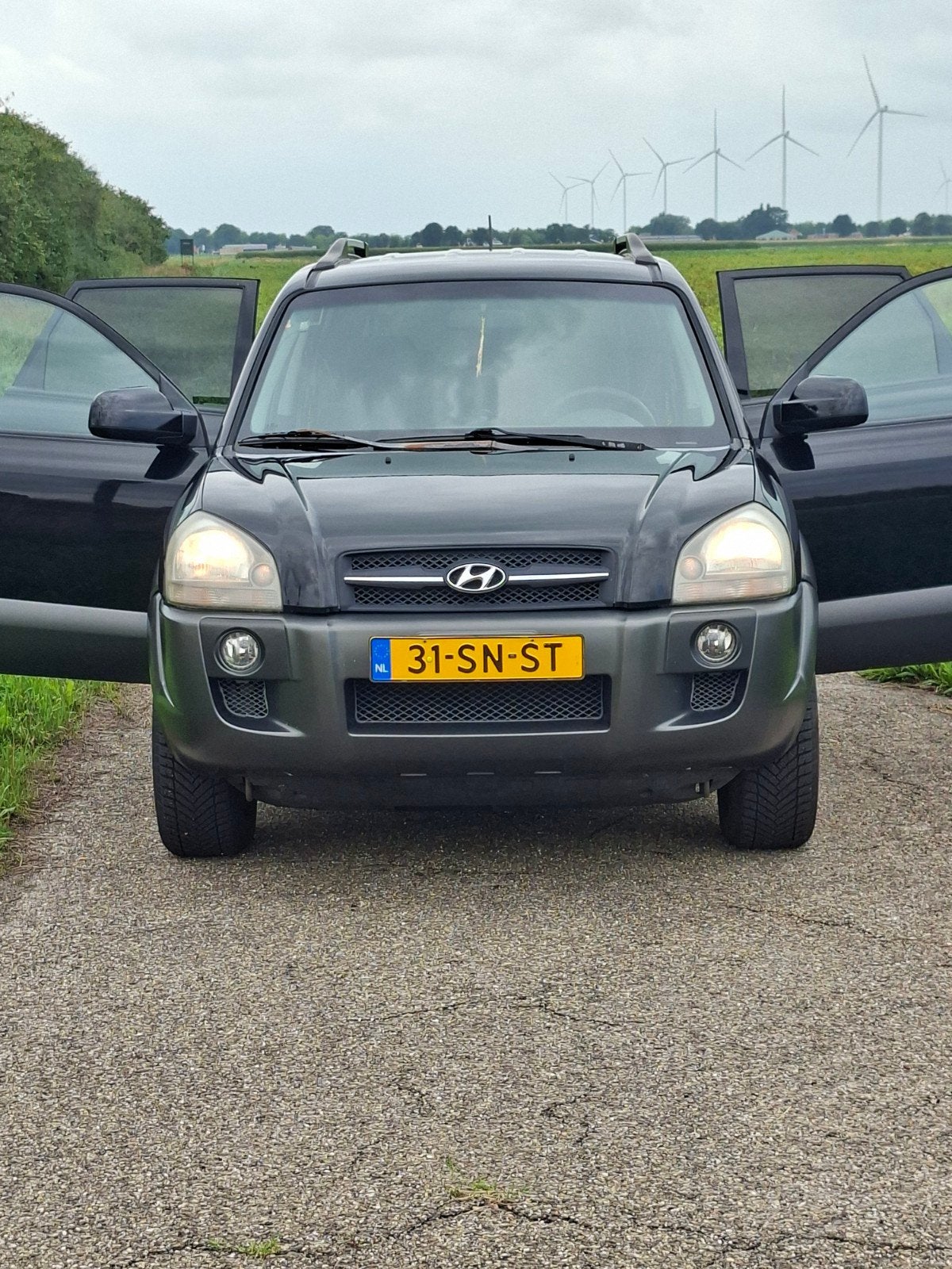 Hyundai Tucson 2.0 I 2WD 2006 Zwart, Auto's, 4 cilinders, Zwart, Origineel Nederlands, 75 €/maand