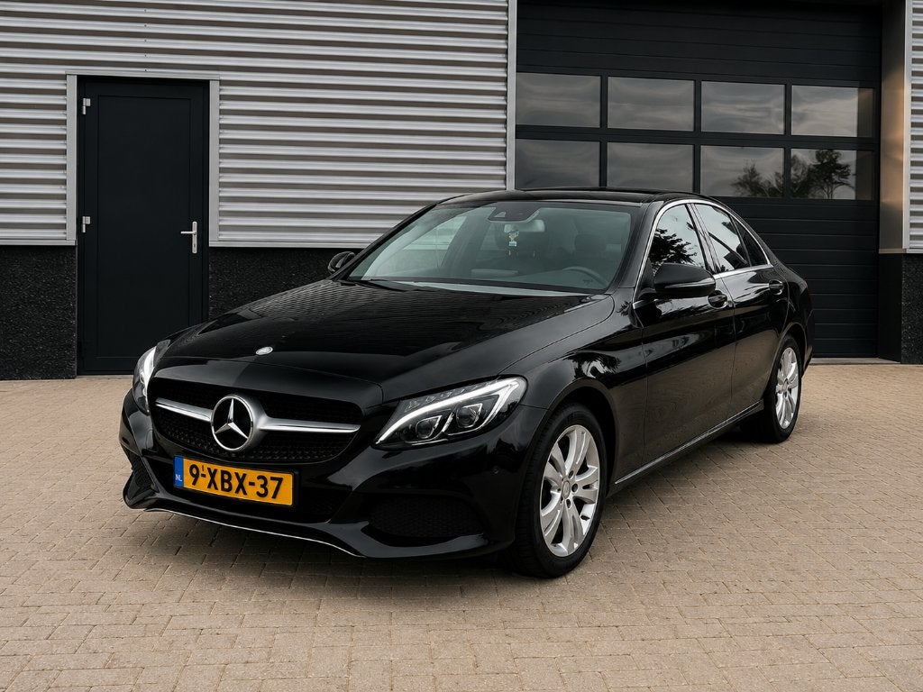 Mercedes-Benz C-Klasse C200 2.0 Prestige  Aut7  Zwart, 1800 kg, 4 cilinders, Leder en Stof, Zwart