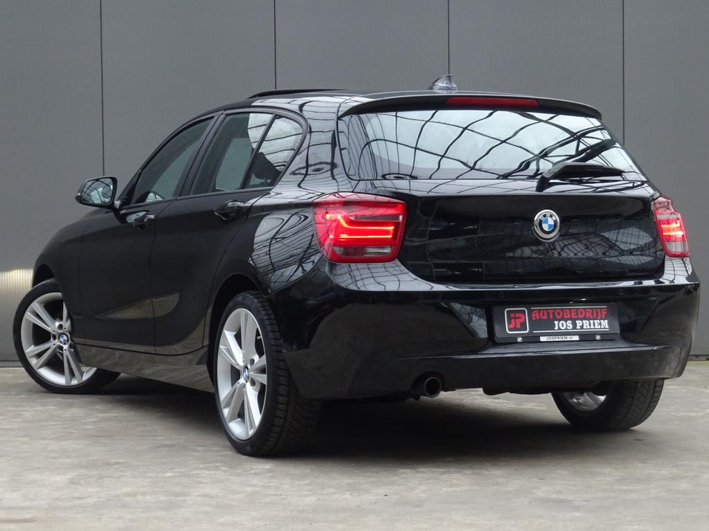 BMW 1-serie 116i Limited Edition * OPEN DAK * PDC * GR NAVIA, Euro 5, Gebruikt, 4 cilinders, Zwart