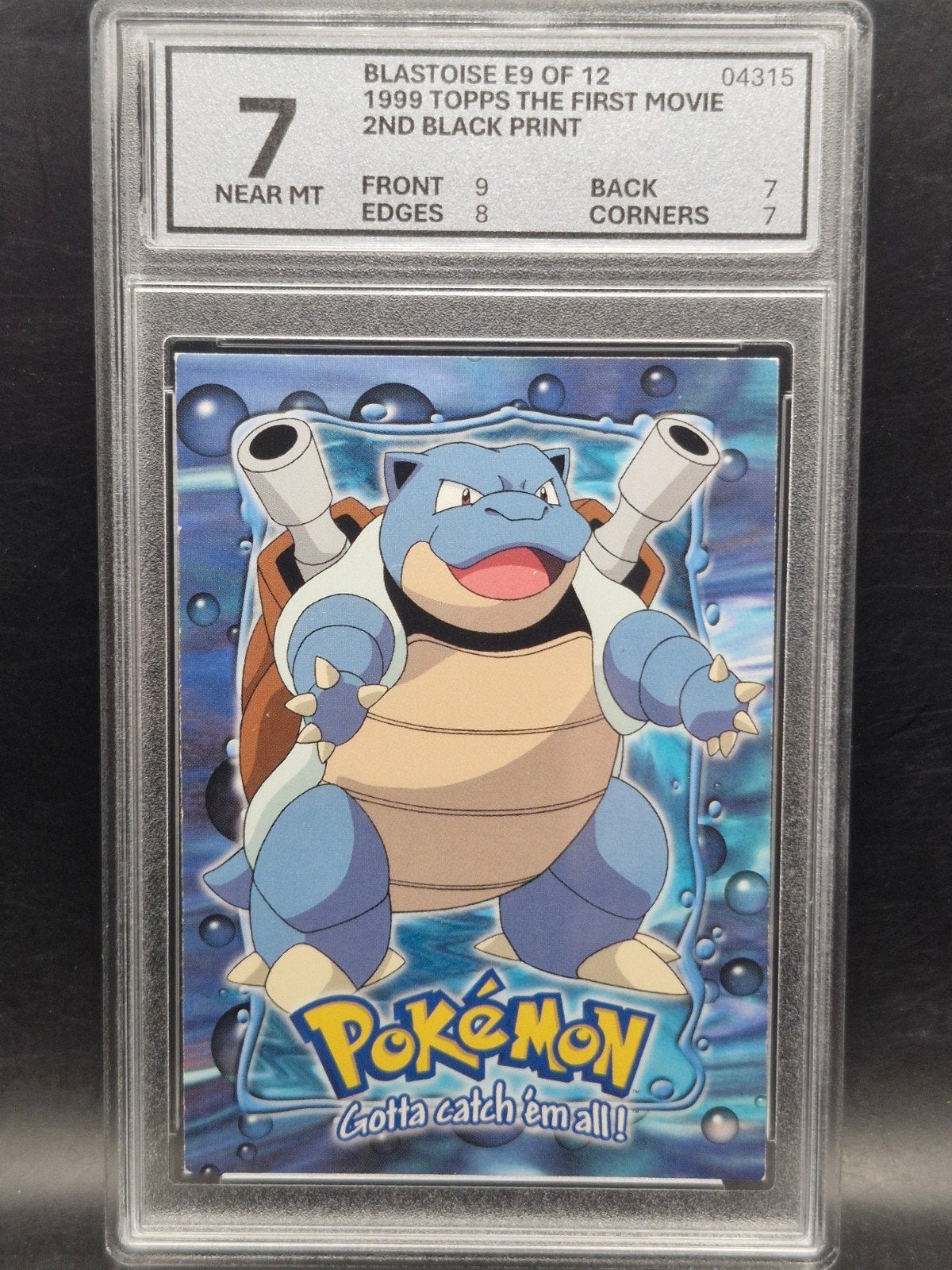Blastoise 1999 topps the first movie #e9 woetoe grading 7, Verzenden, Zo goed als nieuw, Losse kaart