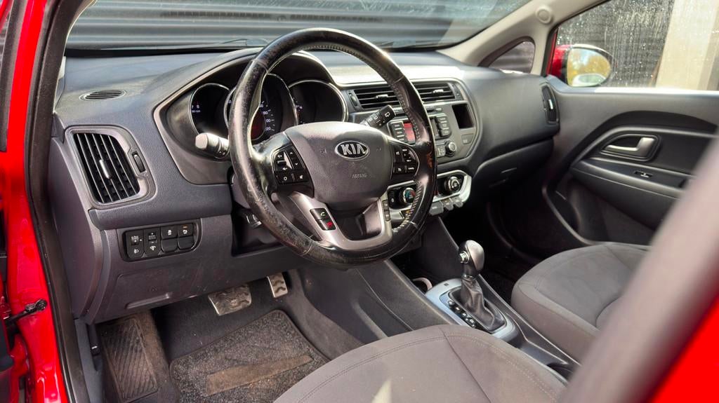 Kia Rio 1.4 CVVT Super Pack | Automaat | Cruise | Bluetooth, Auto's, Euro 5, Gebruikt, Zwart, 4 cilinders