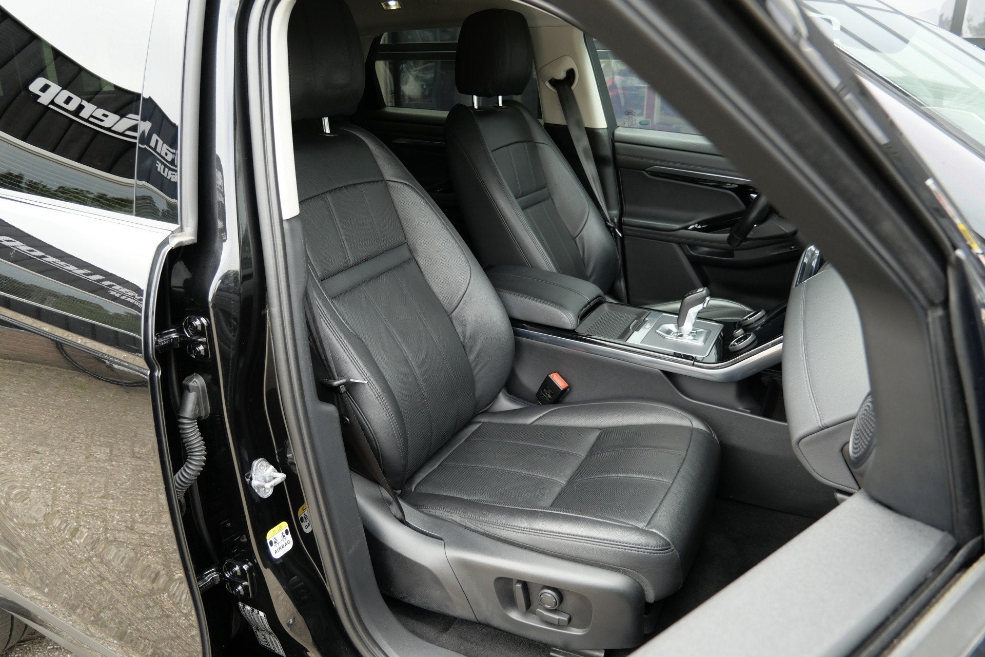Land Rover Range Rover Evoque 2.0 P200 AWD 200PK | Memory |, Auto's, 1800 kg, 4 cilinders, Zwart, Bedrijf