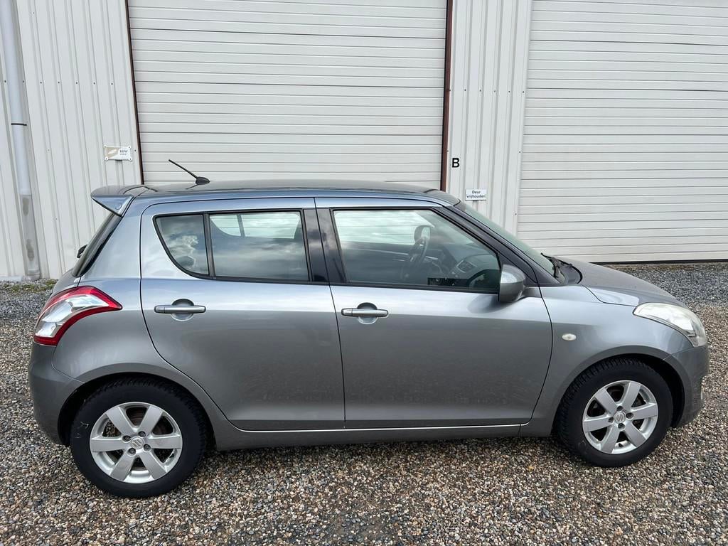 Suzuki Swift 1.2 Bandit EASSS AIRCO.APK.CRUISECONTROL.NAP!, Voorwielaandrijving, Stof, Gebruikt, 4 cilinders