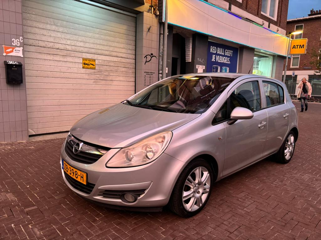 Opel Corsa 1.2 16V 5D 2009 Grijs airco usb radio ipod, Voorwielaandrijving, Stof, 4 cilinders, 1229 cc
