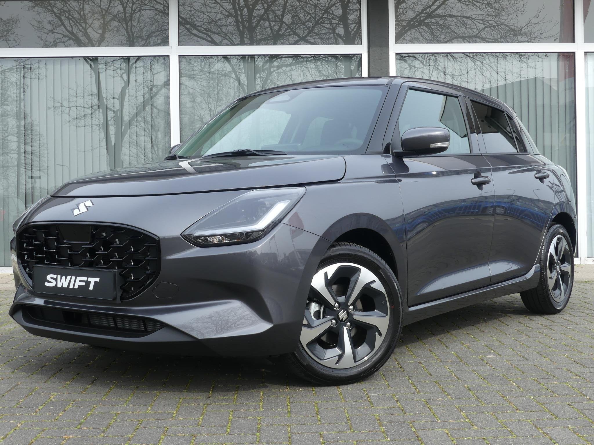 Suzuki Swift 1.2 Style Smart Hybrid NIEUW uit voorraad lever, Auto's, Suzuki, Voorwielaandrijving, 12 maanden, Stof, Bedrijf