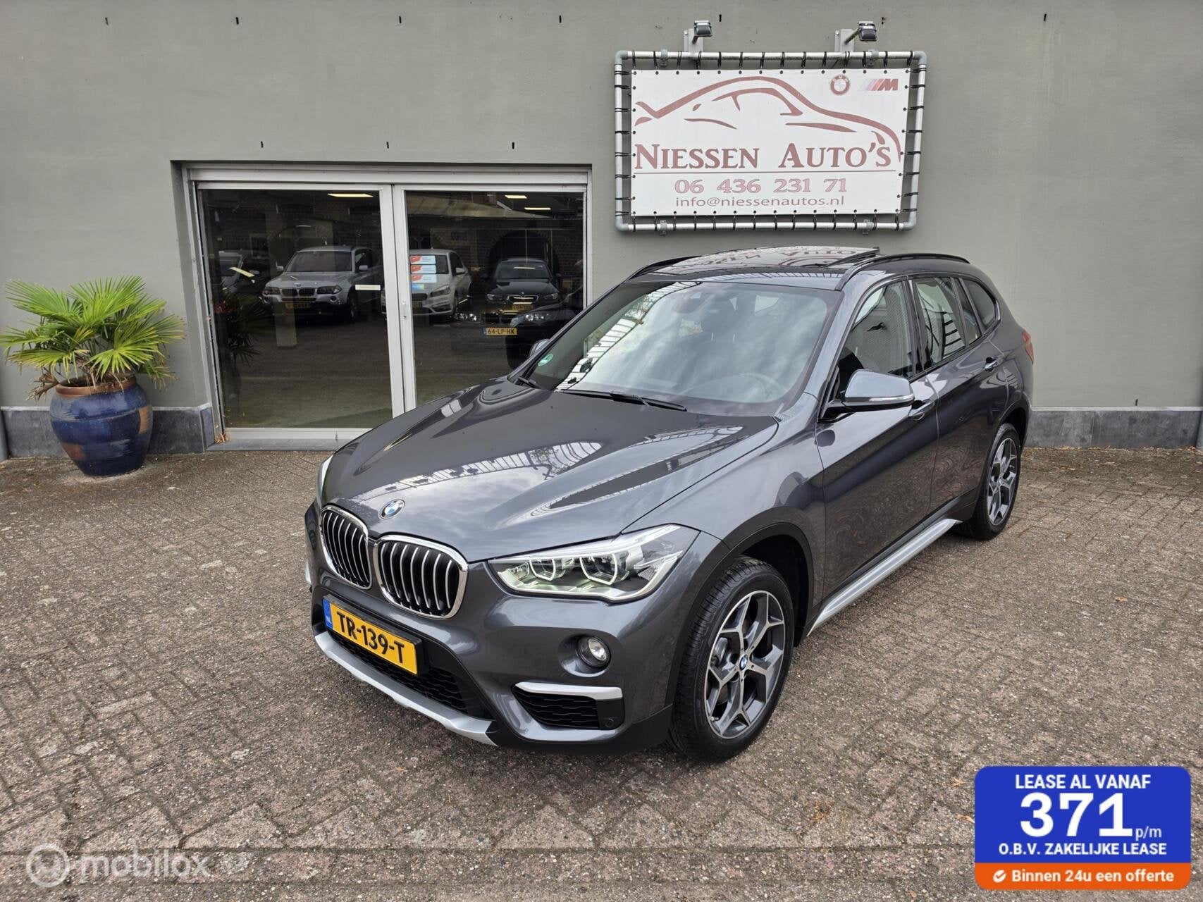 BMW X1 sDrive20i Orange Edition HUD/Pano/Leder/LED/Camera, 1998 cc, 1800 kg, Bedrijf, Automatische klimaatregeling