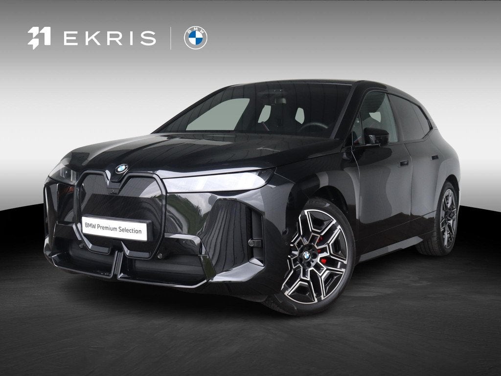 BMW iX xDrive60 | M Sportpakket Pro | Innovation Pack | Harm, Auto's, BMW, Stof, Zwart, Met garantie (alle), Zwart
