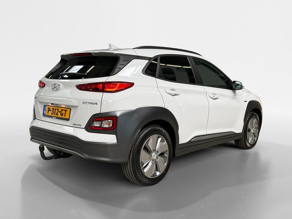 Hyundai KONA EV Fashion 64 kWh I Trekhaak I Camera I CarPlay, Auto's, Hyundai, Gebruikt, 40 min, Wit, Leder